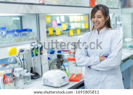 Picture of the scientist working in the laboratory and smiling, Concept science and technology, Science background