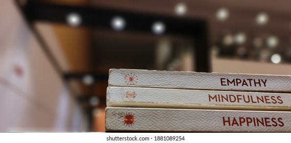 A picture of self help stacked books in a library.