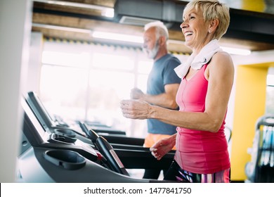 Picture Of Senior People Running On Treadmill In Gym