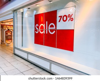 Picture Of Shop At Fashion Store Window Display With Text SALE On Red Poster In The Shopping Mall. Shopping Sale Background