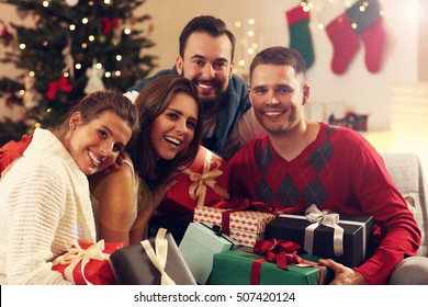 Picture Showing Group Of Friends With Christmas Presents