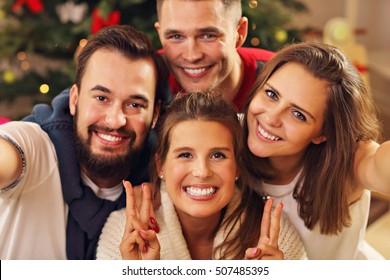 Picture Showing Group Of Friends Taking Selfie During Christmas