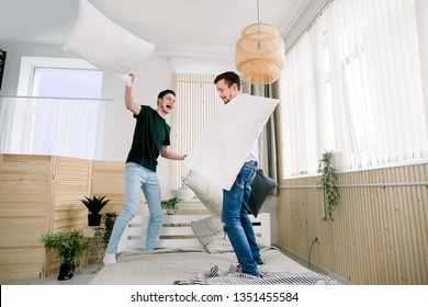 Picture Showing Happy Gay Couple Having Pillow Fight