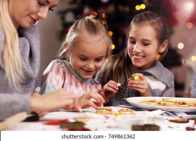 Picture showing joyful family preparing Christmas biscuits Stock Photo