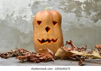 The Picture Shows An Evil Spirit For Halloween, Created From A Pumpkin With Eyes And An Evil Mouth Cut Out.