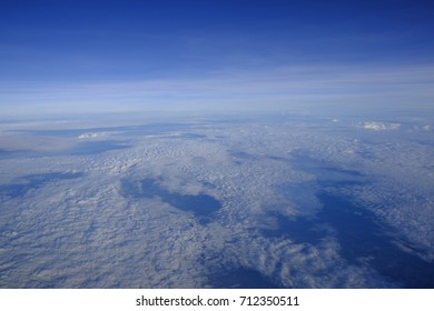A picture of sky above the cloud from airplane window, Soft focus - Shutterstock ID 712350511