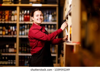 Picture of smiling woman in wine shop