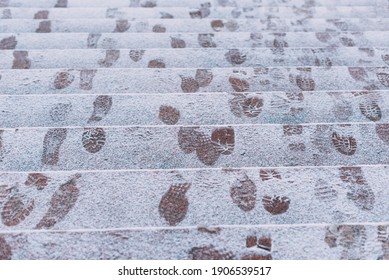 A Picture Of Some Footsteps In Snow On Some Stairs Outside .