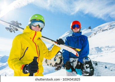 Picture Of Sports Men With Skis And Snowboard In Winter