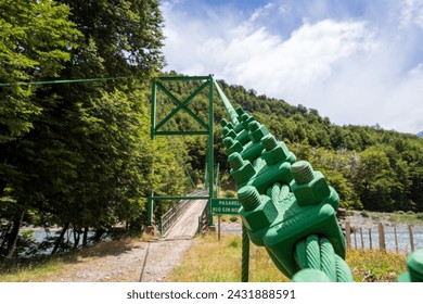 Picture from the suspension cable of a wooden suspension bridge in Chile's Patagonia during the summer