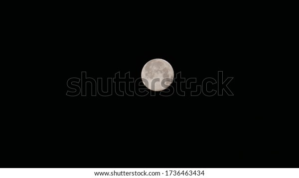 Picture taken of full moon in the month of June. A\
cycle that rotates and comes back. It can make a good background\
photo for using into a story telling or night portfolio. It is a\
Stars less night.