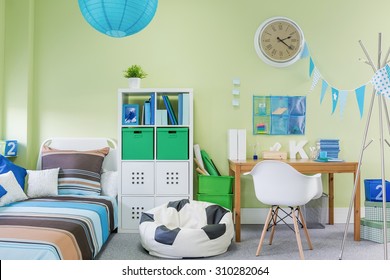 Picture of teenage boy room interior with stylish furniture