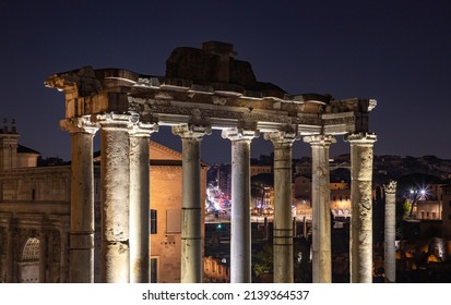 A Picture Of The Temple Of Saturn At Night.