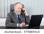 Picture of a thoughtful employer having a phone call