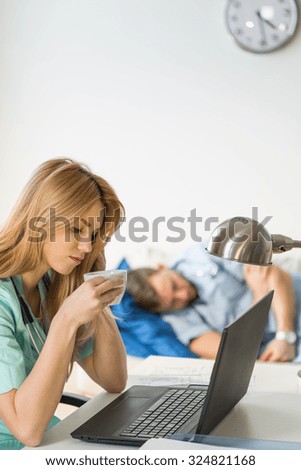 Similar – Female doctor showing results of a medical test on the tablet