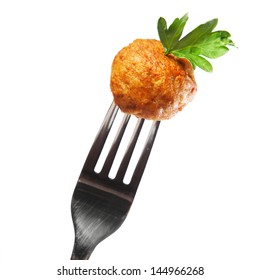 A Picture Of Traditional Swedish Meatball On A Fork Over White Background