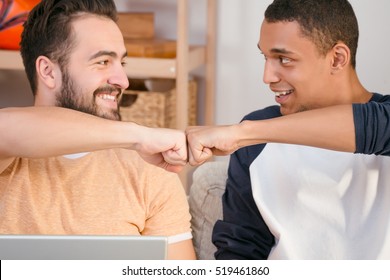 Picture Of Two Best Friends Men Looking At Each Other And Showing Unity Of Their Friendship. Happy Friends Smiling.