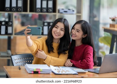 A Picture Of Two Businesswomen Meeting Televised Via Mobile.