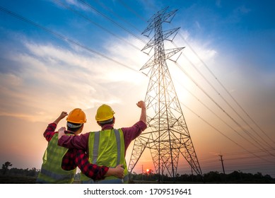 Picture of two electrical engineers standing together at the power station to see their success and rejoice. With the production of electric power - Shutterstock ID 1709519641