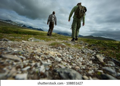 PIcture of a two hikers walking - Powered by Shutterstock