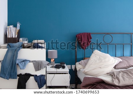 Picture of an untidy bedroom 