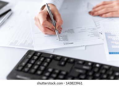 picture of woman hand filling in invoice paper - Powered by Shutterstock