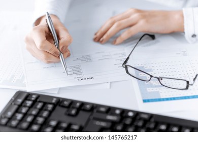 Picture Of Woman Hand Filling In Invoice Paper