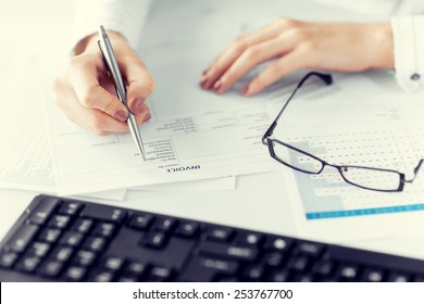 Picture Of Woman Hand Filling In Invoice Paper