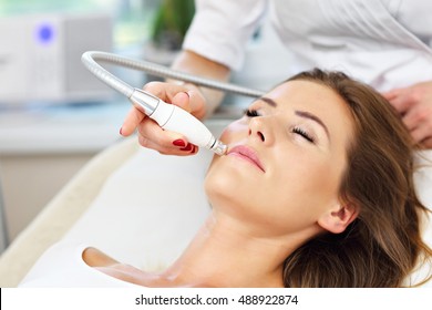 Picture Of Woman Having Facial Treatment In Beauty Salon