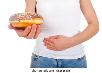 Picture Of A Woman Having Indigestion From Too Much Doughnuts