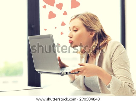 picture of woman with laptop computer sending kisses and hearts