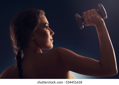 Picture Of Woman Lifting Dumbells