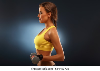 Picture Of Woman Lifting Dumbells