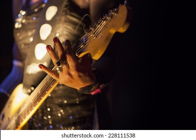 Picture Of A Woman Playing Electric Guitar