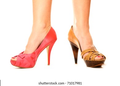 A Picture Of A Woman Standing Against White Background In Two Different Shoes