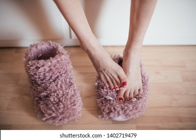 Picture Of Woman's Feet On Home Plush Slippers