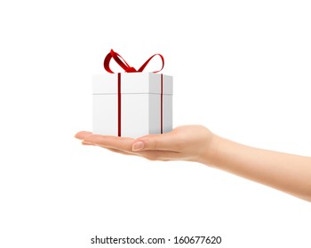 Picture Of Woman's Hands Holding A Gift Box Isolated On White