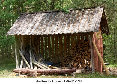 picture with wooden sheds for storing firewood in the yard. High quality photo
