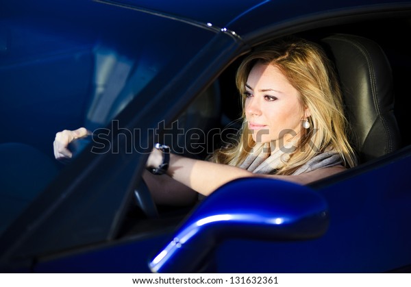 Picture of yang and\
beautiful driving\
woman.