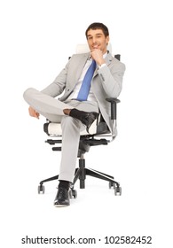 Picture Of Young Businessman Sitting In Chair