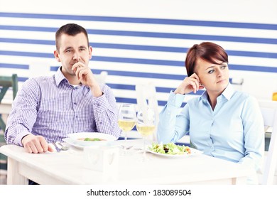 A Picture Of A Young Couple Having An Argument In A Restaurant