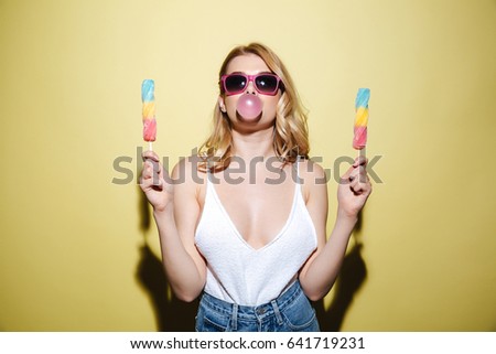 Similar – Image, Stock Photo Young and blonde woman holding a strawberry ice cream