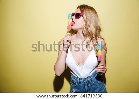 Similar – Image, Stock Photo Young and blonde woman holding a strawberry ice cream