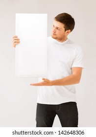 Picture Of Young Man Holding White Blank Board