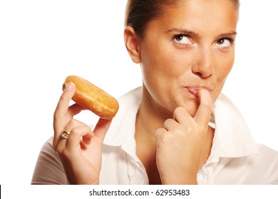 A Picture Of A Young Wife Trying To Resist The Temptation Of Eating A Donut