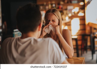 Picture From A Young Woman With Handkerchief. Sick Girl Isolated Has Runny Nose. Female Model Makes A Cure For The Common Cold