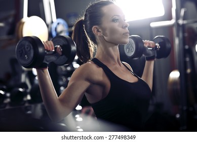 Picture Of Young Woman Making Exercise At The Gym