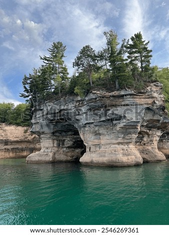 Pictured Rocks National Lakeshore Beautiful Scenic Views from the Water Lake Superior with Erosion, Sandstone Cliffs, Beaches, Waterfalls, Deep Forest, and Wild Shoreline with Clear Serene Water.