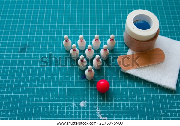 Pictures of bowling pins, surgical tape, gauze,\
bandages and cutting\
mats