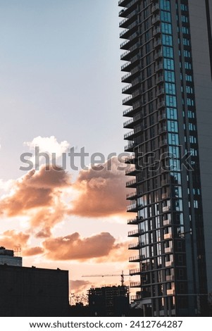 Pictures of city buildings with large windows and glass, ancient constructions, churches.